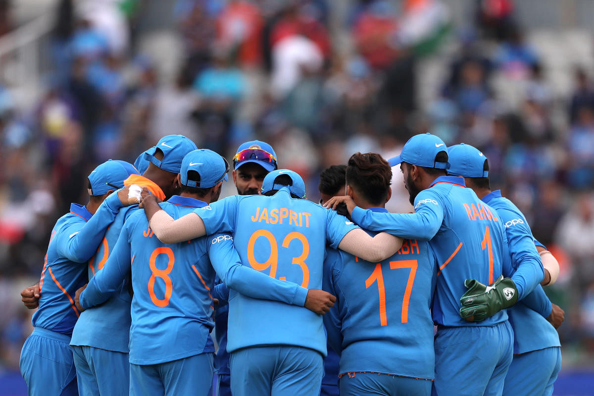 Cricket - ICC Cricket World Cup Semi Final - India v New Zealand - Old Trafford, Manchester, Britain - July 9, 2019 India players in a huddle before the match Action Images via Reuters/Lee Smith