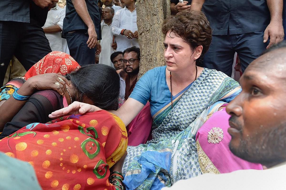 Congress General Secretary Priyanka Gandhi Vadra consoles a family member of Sonbhadra massacre victim, who had travelled to Chunar Fort to meet her after the former was stopped from proceeding to Sonbhadra, in Mirzapur, Saturday, July 20, 2019. (PTI Phot