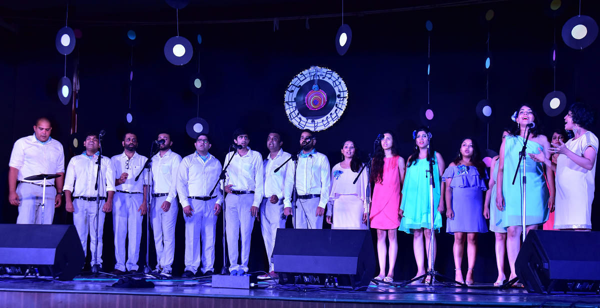 Conductor, Pianist Shubira D'Sa (right) leads 'Poco-A-Poco's' talented amateur vocalists and musicians at Sri Sudhindra Auditorium in Canara Girls High School on Saturday. 