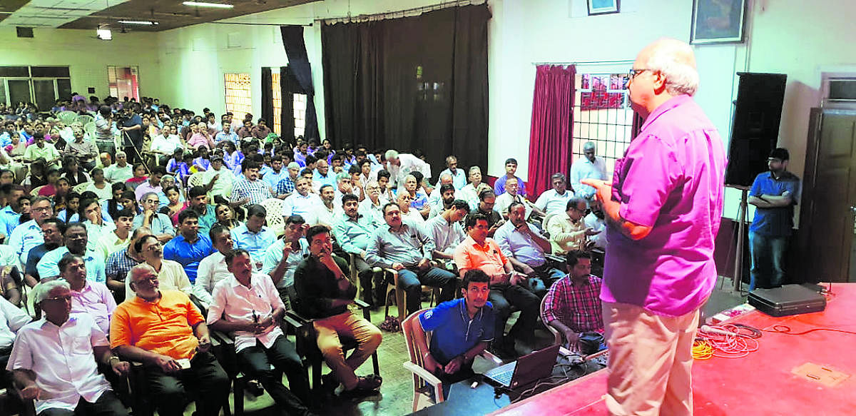 Water conservation expert Shree Padre speaks at a workshop on rainwater harvesting at MGM College in Udupi on Saturday.