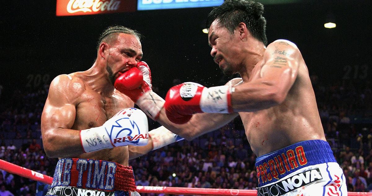 Filipino boxer Manny Pacquiao (R) slams a right to the face of US boxer Keith Thurman during their WBA super world welterweight title fight at the MGM Grand Garden Arena on July 20, 2019 in Las Vegas, Nevada. - Pacquiao won a 12 round split decision. (Pho