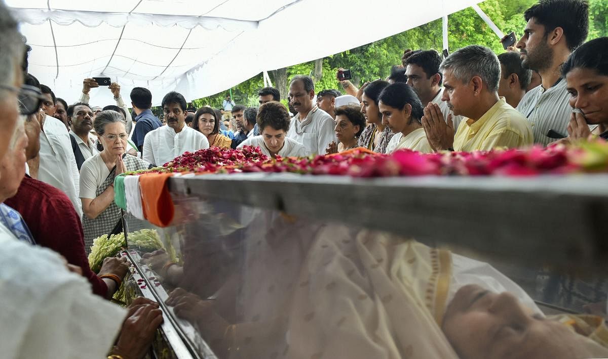 Congress Parliamentary Party (CPP) chairperson Sonia Gandhi and party General Secretary Priyanka Gandhi Vadra pay tributes to former Delhi chief minister Sheila Dikshit at Congress headquarters, in New Delhi, Sunday, July 21, 2019. (PTI Photo)
