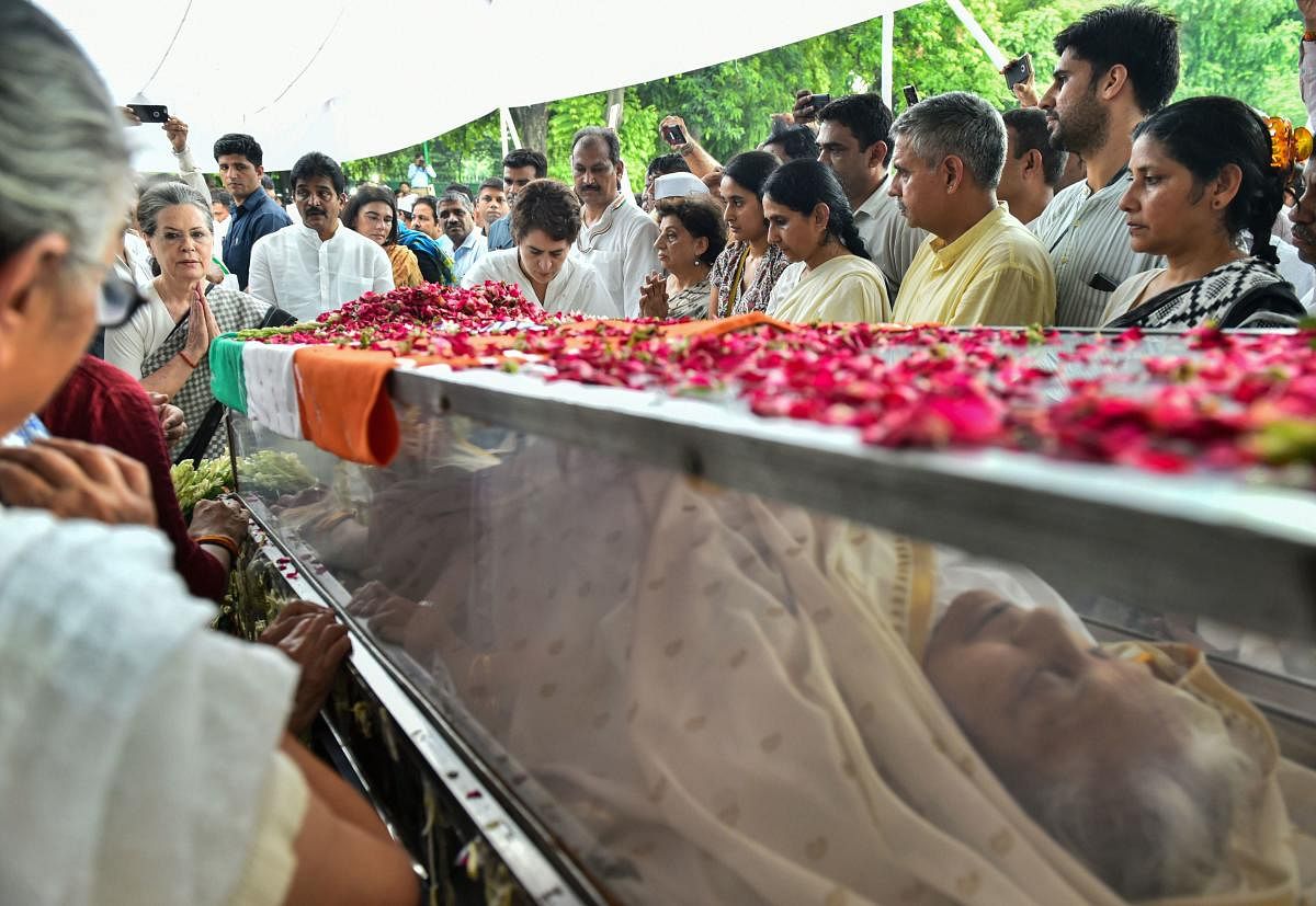 Congress Parliamentary Party chairperson Sonia Gandhi pays her last respects to the mortal remains of former Delhi chief minister Sheila Dikshit at the AICC headquarters in New Delhi (PTI Photo)