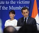 French President Nicolas Sarkozy and wife Carla Bruni-Sarkozy during a ceremony to pay tribute to the victims of the Mumbai terror attacks, in Mumbai on Tuesday. AP