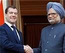 Prime Minister Manmohan Singh and Russian President Dmitry Medvedev shake hands before a meeting at Hyderabad House in New Delhi on Tuesday. PTI