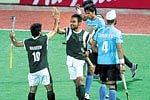 Sohail Abbas (centre) celebrates with Waseem Ahmed after scoring Pakistan's winning goal against India in the Asia Cup hockey tournament on Sunday.AFP
