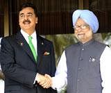 Prime Minister Manmohan Singh with Pakistan Prime Minister Yusuf Raza Gilani during the 17th South Asian Association for Regional Cooperation (SAARC) summit in Addu, Maldives on Thursday. AFP