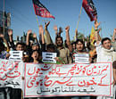 Pakistani Shiite Muslims protesters march as they react against yesterday's bomb attack in Quetta, in Karachi on February 17, 2013. The death toll from a devastating bomb attack on Shiite Muslims in southwest Pakistan rose to 81 Sunday, as the community threatened protests if swift action was not taken against the killers. AFP PHOTO/Asif HASSAN