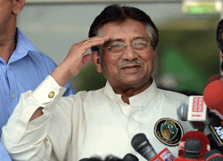 Pakistan's former military ruler Pervez Musharraf salutes supporters outside the airport in Karachi on March 24, 2013. Pakistan's former military ruler Pervez Musharraf returned home after more than four years in exile, defying a Taliban death threat to contest historic general elections. AFP PHOTO