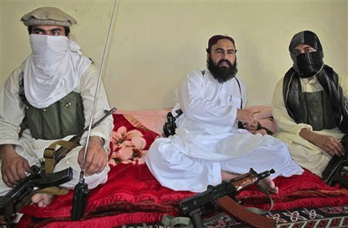 Deputy Pakistani Taliban leader Wali-ur-Rehman (C) is flanked by militants as he speaks to a group of reporters in Shawal town, which lies between North and South Waziristan region in the northwest bordering Afghanistan, in this July 28, 2011 file photo. Reuters