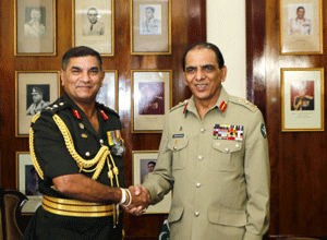 Sri Lankan army commander Gen. Jagath Jayasuriya, left, shakes hands with his Pakistani counterpart Gen. Ashfaq Parvez Kayani as they pose for photos at their meeting in Colombo, Sri Lanka, Friday, June 28, 2013. Kayani arrived in Sri Lanka on Thursday on a three-day official visit where he will meet Sri Lanka's top defense officers. AP photo