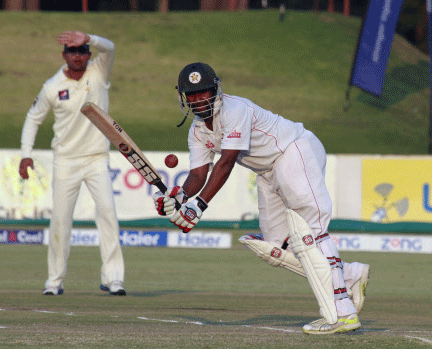 Zimbabwean batsman Tinotenda Mawoyo plays a shot on the third day of the last test match against Pakistan at Harare Sports Club in Harare. AP Photo.