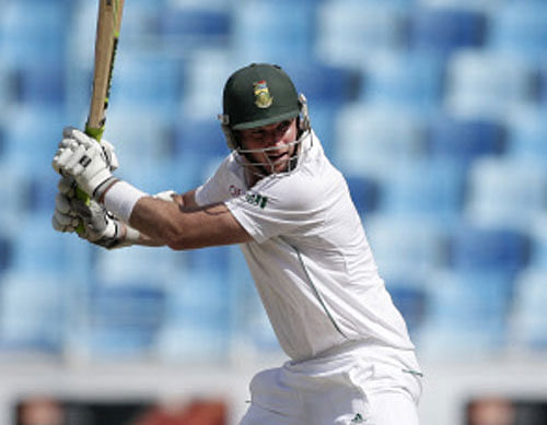 Graeme Smith, captain of South Africa, hits a shot during the second day of the second cricket test match of a two match series between Pakistan and South Africa at the Dubai International Cricket Stadium in Dubai, United Arab Emirates, Thursday, Oct. 24, 2013. (AP Photo/Hassan Ammar)