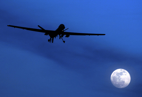 FILE - In this Jan. 31, 2010 file photo, an unmanned U.S. Predator drone flies over Kandahar Air Field, southern Afghanistan, on a moon-lit night. A U.N. expert on Friday, Oct. 18, 2013 called on the United States to reveal the number of civilians it believes have been killed by American drone strikes targeting Islamic militants. U.N. Special Rapporteur Ben Emmerson said that preliminary information gathered for a new report indicated more than 450 civilians may have been killed by drone strikes in Pakistan, Afghanistan and Yemen, but more work needs to be done to confirm the figures. AP photo