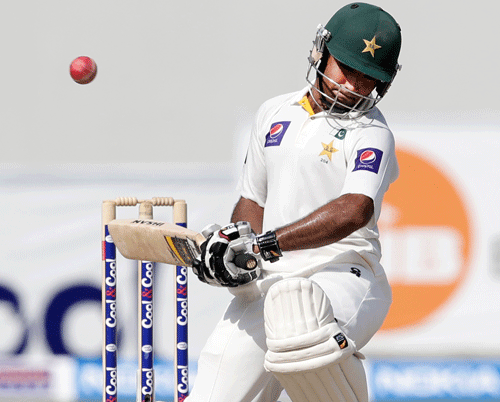 Pakistan's Asad Shafiq avoids a bouncer during the fourth day of the second cricket test match of a two match series between Pakistan and South Africa at the Dubai International Cricket Stadium in Dubai, United Arab Emirates, Saturday, Oct. 26, 2013. (AP Photo/Hassan Ammar)