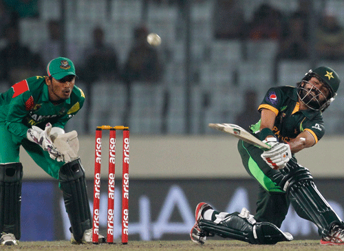 Pakistan's Fawad Alam plays a ball as Bangladesh's wicketkeeper Anamul Haque (L) watches during their one-day international (ODI) cricket match in Asia Cup 2014 in Dhaka March 4, 2014. REUTERS
