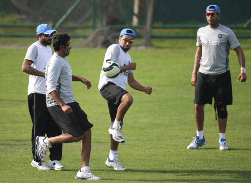 Members of Indian cricket team, from left, Ravindra Jadeja, Ravichandran Ashwin, Rohit Sharma and Yuvraj Singh play a friendly game of soccer during a training session ahead of their ICC Twenty20 Cricket World Cup match against Pakistan in Dhaka, Bangladesh, Thursday, March 20, 2014. AP photo