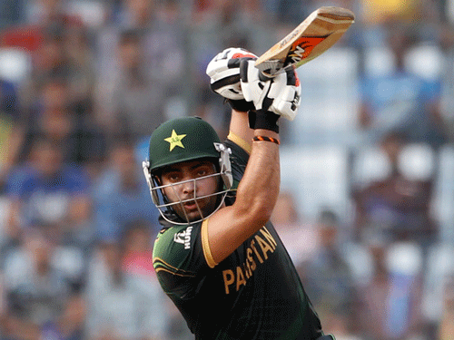 Pakistan's Umar Akmal plays a ball against Australia during their ICC Twenty20 World Cup match at the Sher-E-Bangla National Cricket Stadium in Dhaka March 23, 2014. REUTERS