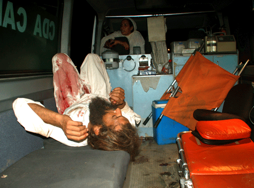 A man injured in a bomb blast lies in an ambulance at a hospital in Islamabad June 20, 2014. At least 39 people were injured in the suicide attack targeting a shrine of Chan Pir Badsah in the Pindorian neighbourhood on the outskirts of Islamabad, according to local media. REUTERS