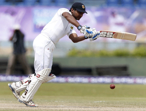 Sri Lanka's Kumar Sangakkara plays a shot during the fourth day of their first test cricket match against Pakistan in Galle August 9, 2014. Reuters photo