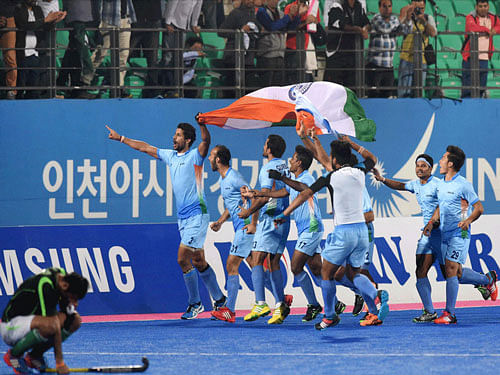 Indian hockey players celebrate their victory over Pakistan during the men's hockey final at the 17th Asian Games in Incheon, South Korea, on Thursday. PTI