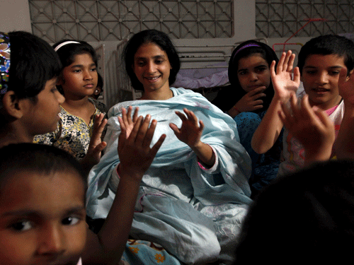 Geeta (C), plays with children at the Bilquis Edhi Foundation in Karachi, Pakistan, October 25, 2015.  Reuters