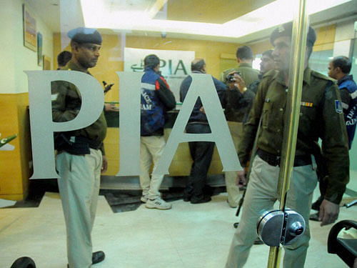 Policemen inspecting inside the Pakistan International Airlines office after Hindu Sena reportedly vandalized it in New Delhi on Thursday. PTI