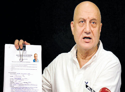 Actor Anupam Kher, who was denied a visa by Pakistan to attend a literary festival in Karachi, addresses a press conference in Mumbai on Tuesday. PTI