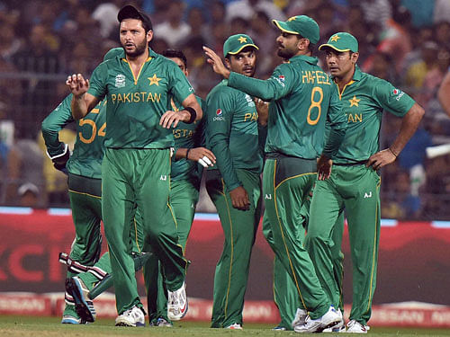 Pakistan players celebrate dismissal of Indian batsman Rohit Sharma during ICC T20 World cup match against Pakistan at Eden Garden in Kolkata on Saturday. PTI Photo