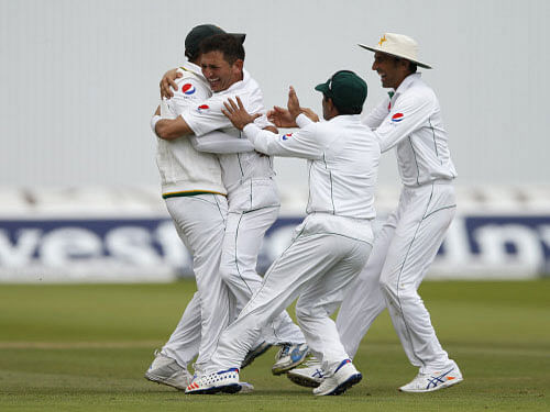 Pakistan's Yasir Shah celebrates taking the wicket of England's Moeen Ali . Action Images via Reuters