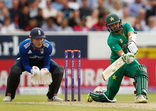 Pakistan's Azhar Ali hits a six as England's Jonny Bairstow looks. Reuters
