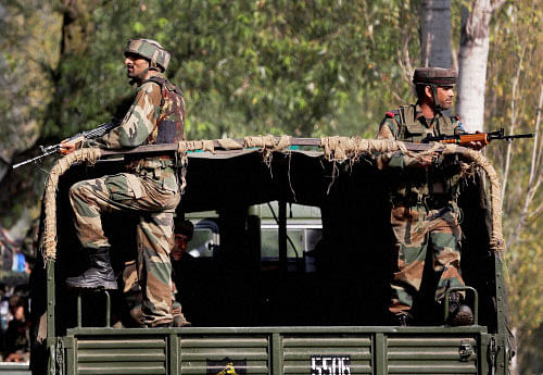 Soldiers guard outside the army base which was attacked suspected militants in Uri, Jammu and Kashmir on Monday. PTI Photo