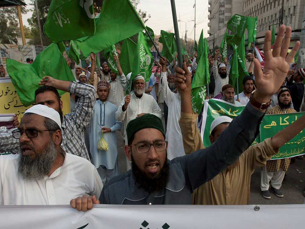 People protest against a recent attack at a shrine, in Karachi, Pakistan, Friday, Feb. 17, 2017. A brutal attack on a beloved Sufi shrine that killed dozens of people raised fears that the Islamic State group has become emboldened in Pakistan, aided by an army of homegrown militants benefiting from hideouts in neighboring Afghanistan, analysts and officials said Friday. AP/PTI Photo