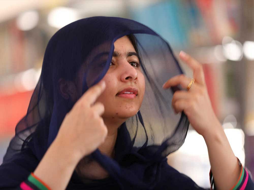 Nobel laureate Malala Yousafzai adjusts her head scarf during an exclusive interview with Reuters in Maiduguri, Nigeria July 18, 2017. Reuters/Afolabi Sotunde