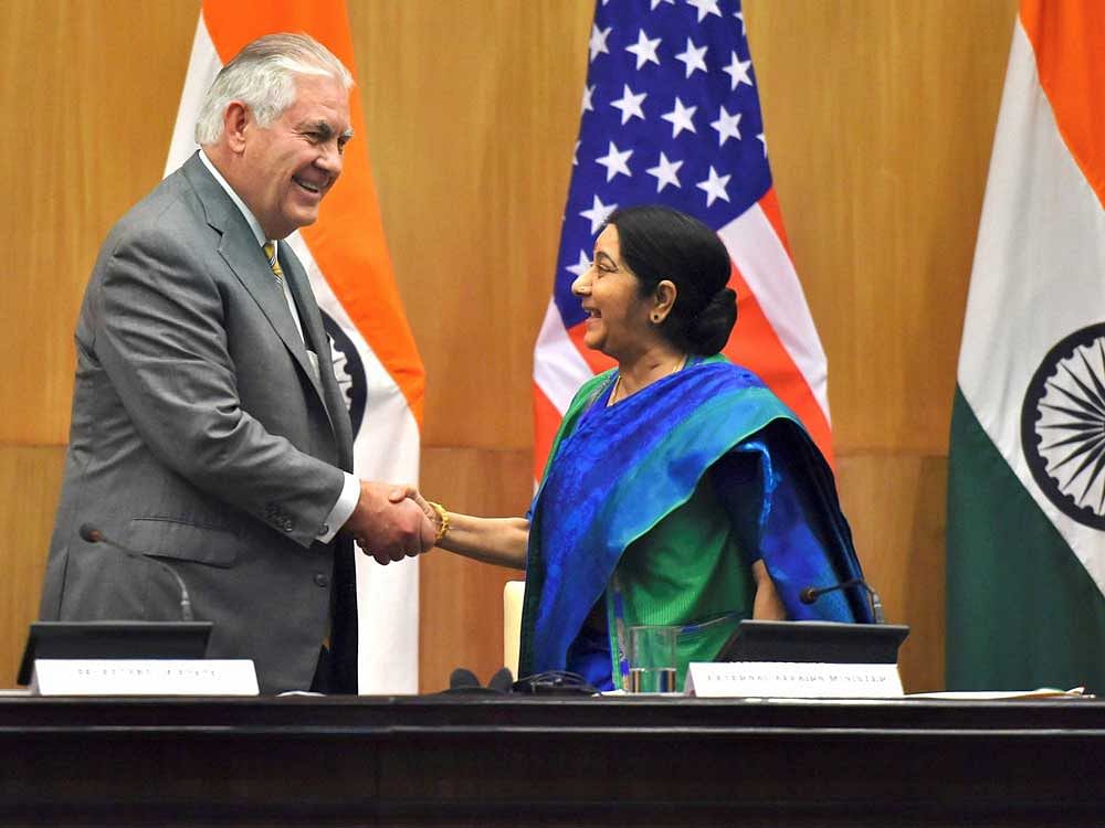 Minister for External Affairs Sushma Swaraj and US Secretary of State Rex Tillerson shake hands after their joint press conference in New Delhi on Wednesday. PTI Photo