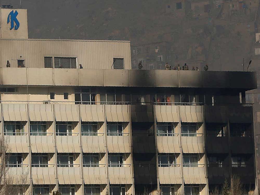 Afghan security forces are seen at the roof top of the Intercontinental Hotel in Kabul, Reuters photo
