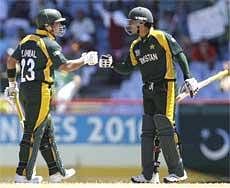 Pakistan's Kamran Akmal (left) and Salman Butt during Twenty20 Cricket World Cup match against Bangladesh in St. Lucia on Saturday. AP