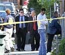 FBI investigators gather evidence and block the sidewalk in front of the former home of suspected Pakistani-American Faisal Shahzad on Sheridan Street in Bridgeport on Tuesday. Reuters
