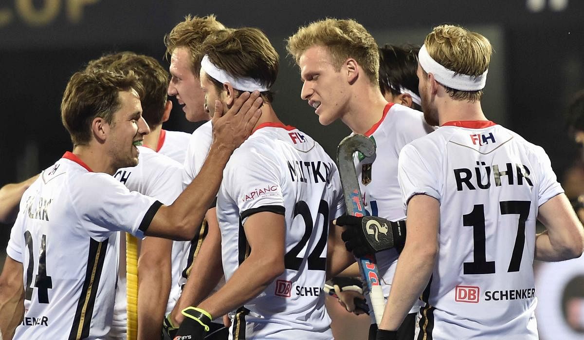 Germany's Marco Miltkau (centre) celebrate with team-mates after scoring against Pakistan. PTI 