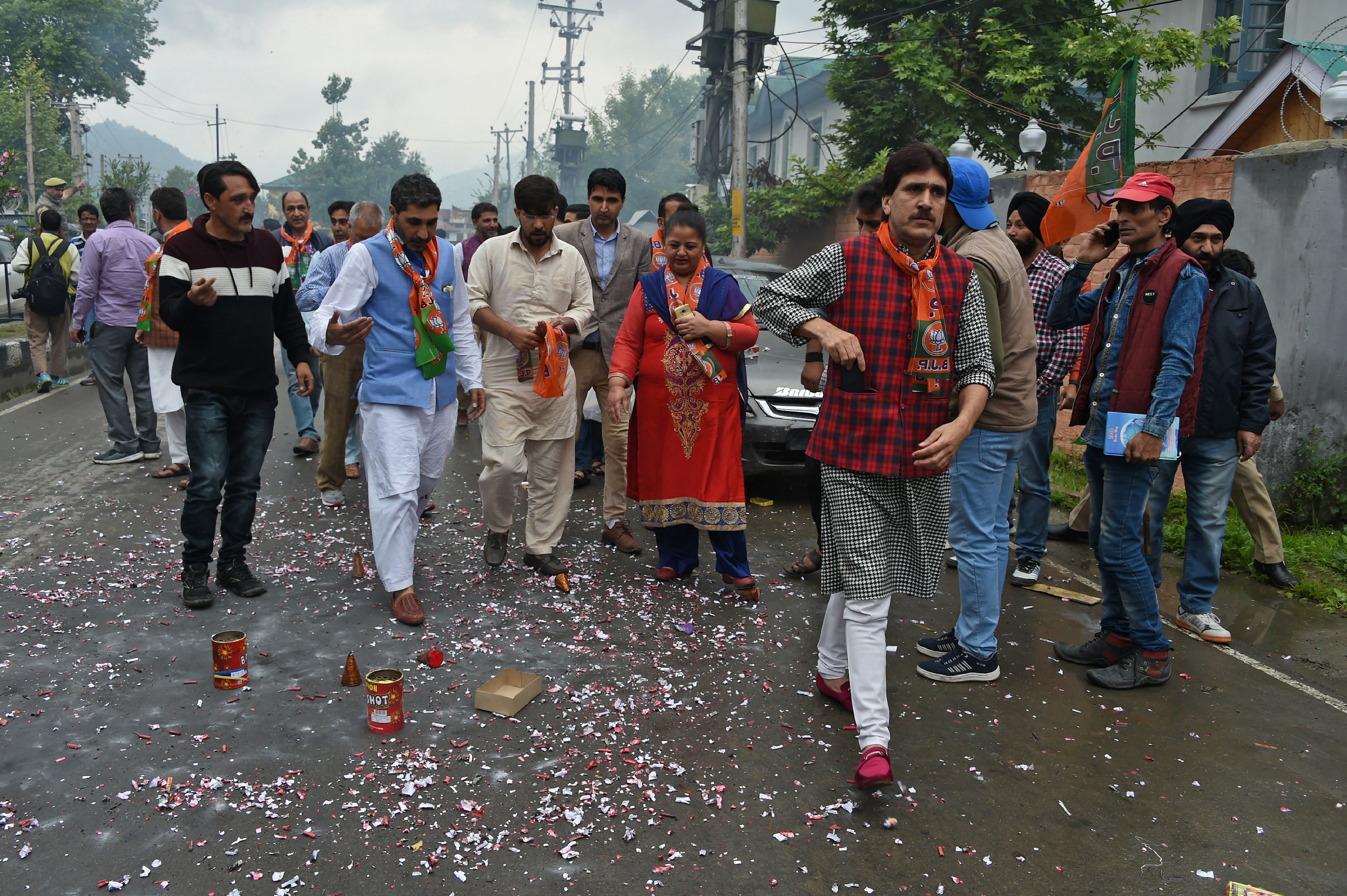 Kashmiri Bhartiya Janata Party (BJP) activists celebrate the poll results of India's general election in Srinagar on May 23, 2019. - India's Prime Minister Narendra Modi claimed victory on May 23 in the country's elections, promising an "inclusive" future after his Hindu nationalist party appeared headed for a landslide win. According to Election Commission data based on votes counted so far, Modi's Bharatiya Janata Party (BJP) is on course to win around 300 of 543 elected seats in India's lower house, surpassing its 2014 victory and crushing the opposition Congress party's hopes of a comeback. (Photo by TAUSEEF MUSTAFA / AFP)