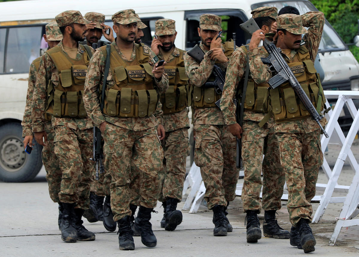 Pakistani soldiers on guard during the recently concluded general election in Rawalpindi on July 24. Reuters