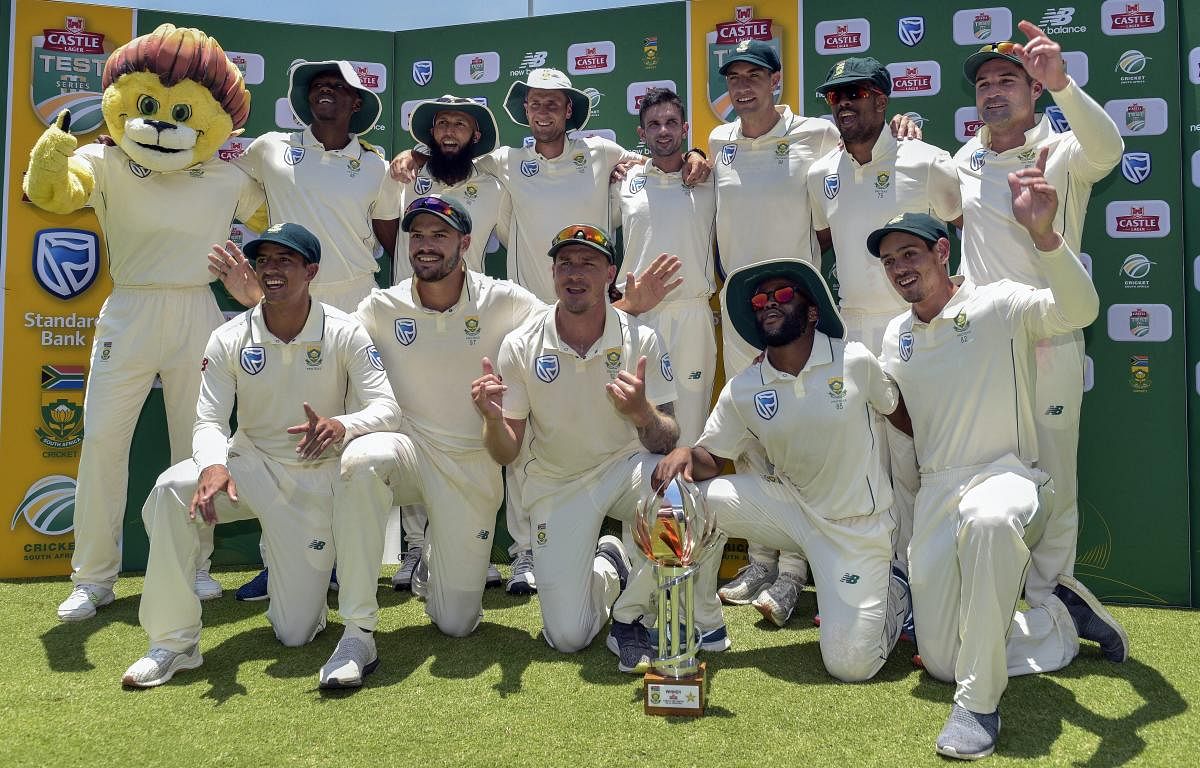South Africa with the series trophy after beating Pakistan by 107-run in the third Test in Johannesburg on Monday. AP/PTI