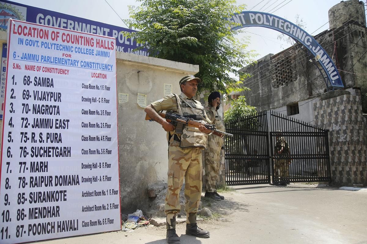 Jammu: Security personnel stand guard outside the building of counting halls, ahead of the counting process of 2019 Lok Sabha elections, in Jammu. (PTI Photo)
