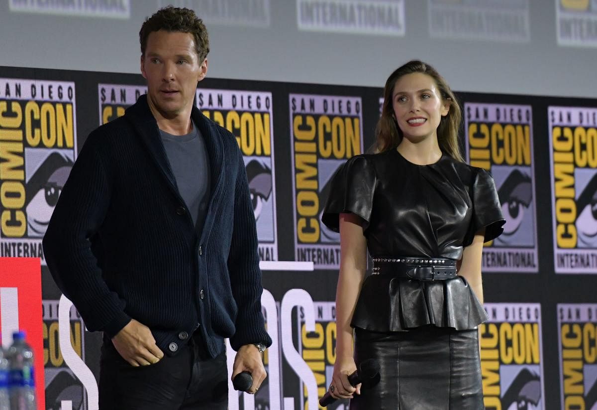 English actor Benedict Cumberbatch and US actress Elizabeth Olsen during the Marvel panel in Hall H of the Convention Center during Comic Con in San Diego, California on July 20, 2019. (Photo by Chris Delmas / AFP)