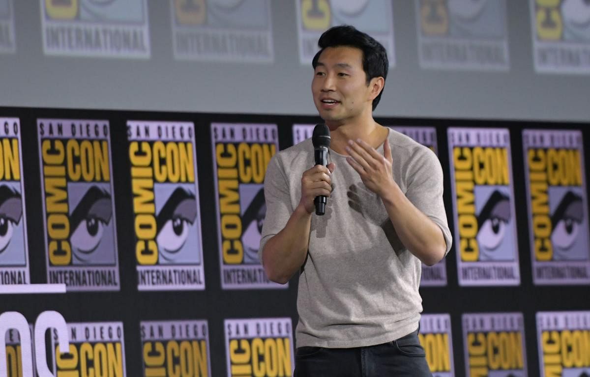 Canadian actor Simu Liu speaks on stage for the Marvel panel in Hall H of the Convention Center during Comic-Con in San Diego, California on July 20, 2019. (Photo by Chris Delmas / AFP)