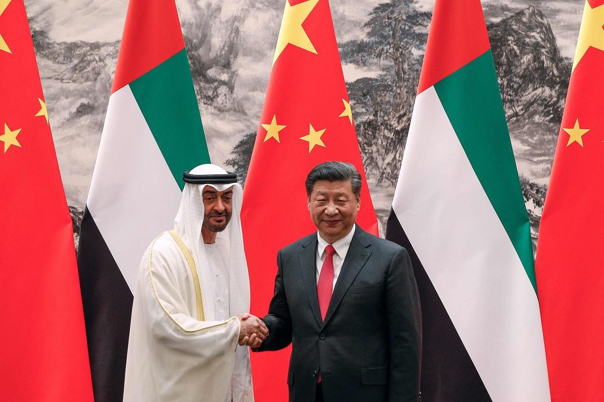 Abu Dhabi's Crown Prince Mohammed bin Zayed (L) with Chinese President Xi Jinping. Photo credit: AFP