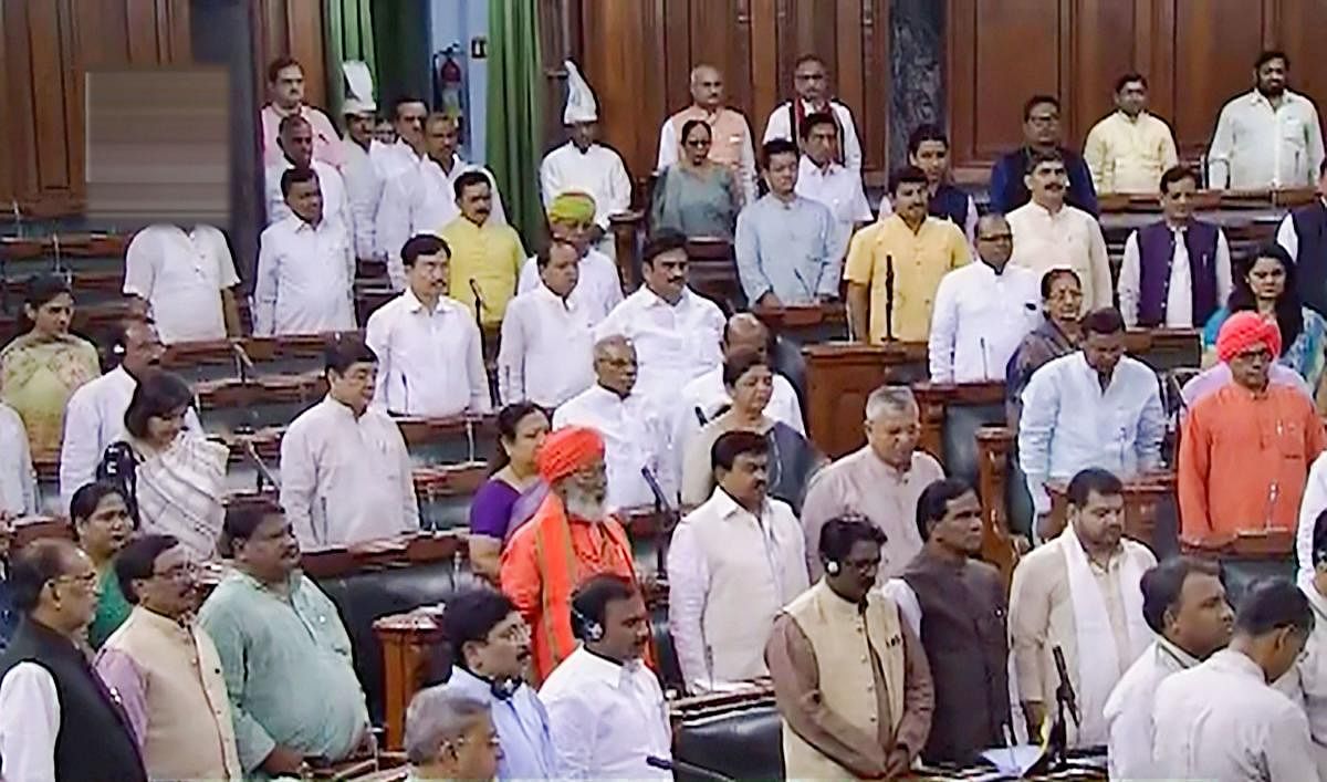 Parliamentarians observe silence during an obituary reference of sitting member Ram Chandra Paswan and former Delhi chief minister Sheila Dikshit in the Lok Sabha, during the ongoing Budget Session of Parliament. (PTI Photo)