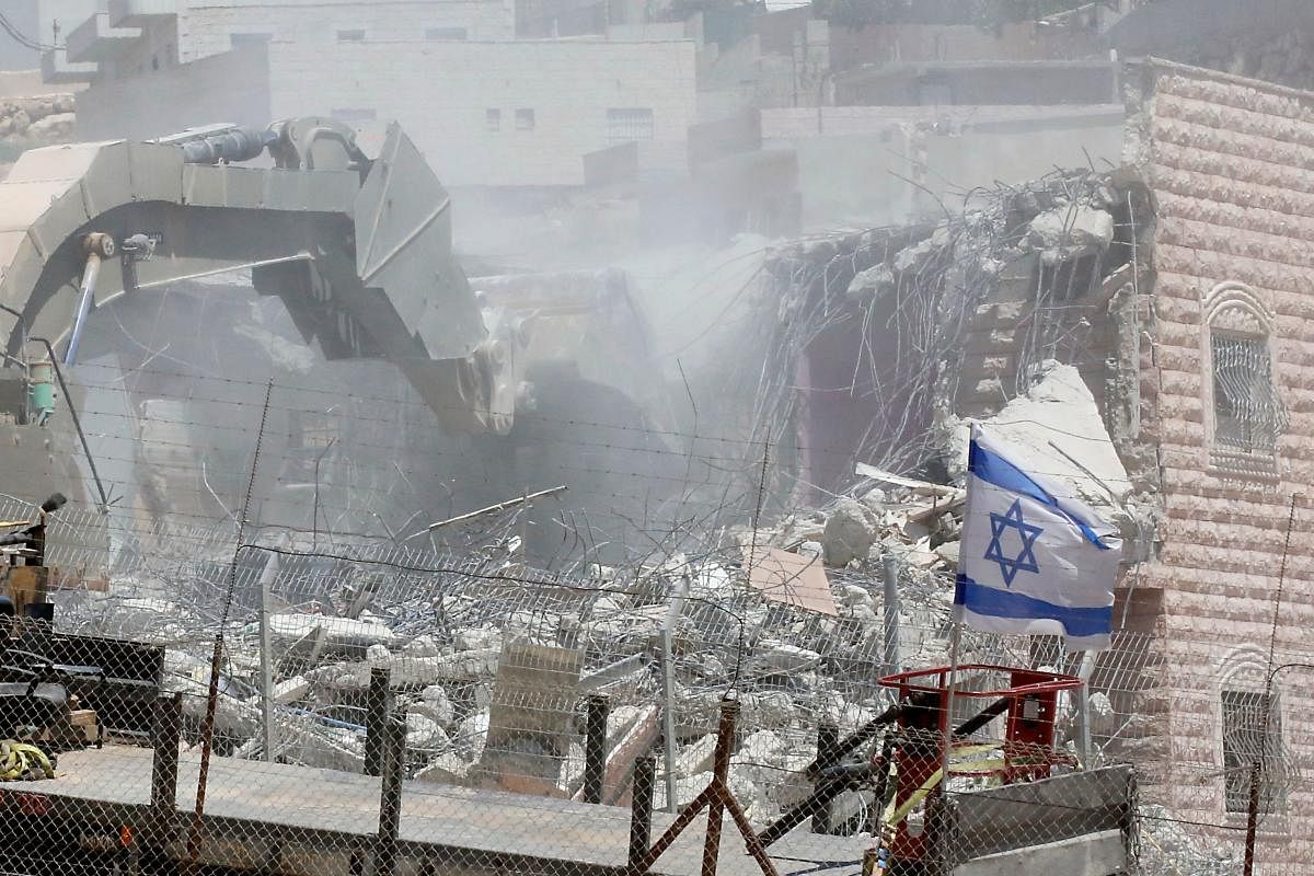 Israel says the buildings were built too close to the separation barrier that it built to stop attacks from the West Bank. Palestinians accuse Israel of using security as a pretext to force them out of the area, meant to be under Palestinian Authority civilian control under the Oslo accords, as part of long-term efforts to expand settlements and roads linked them. Photo/AFP