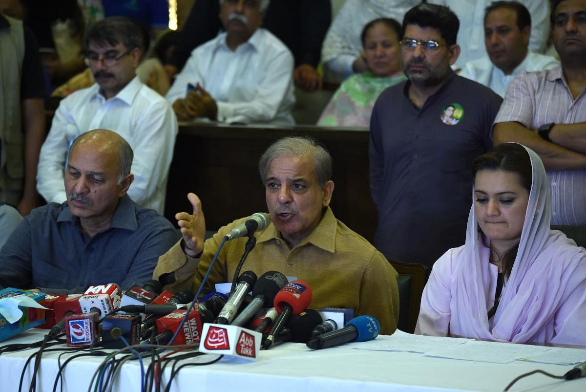 Shahbaz Sharif (C), the younger brother of ousted Pakistani Prime Minister Nawaz Sharif and the head of Pakistan Muslim League-Nawaz (PML-N), gestures as he speaks during a press conference at his political office in Lahore on July 25, 2018, as voting closed in general elections. One of the main candidates in Pakistan's election, Shahbaz Sharif, rejected the results of the poll as counting was still underway, alleging "blatant" rigging. AFP