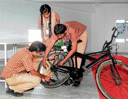 involved Abhishek Sharma, Bhumika and Udaya Kiran with their Eco-Bike.
